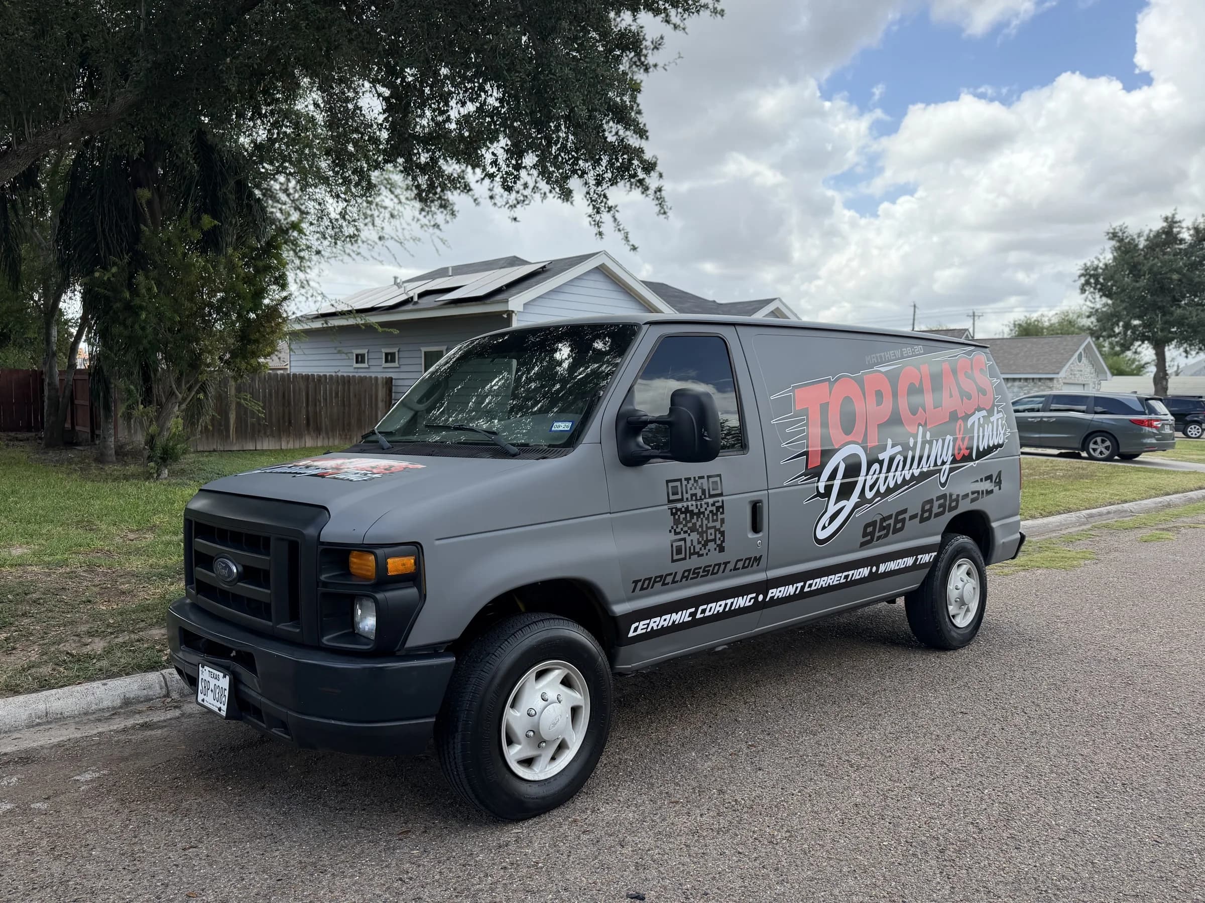 Top Class Detailing and Tints gray Ford work van parked in Edinburg, shown from the front passenger side